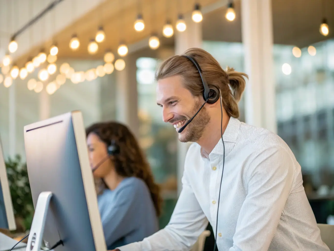 A support engineer assisting a customer remotely, emphasizing the support service.